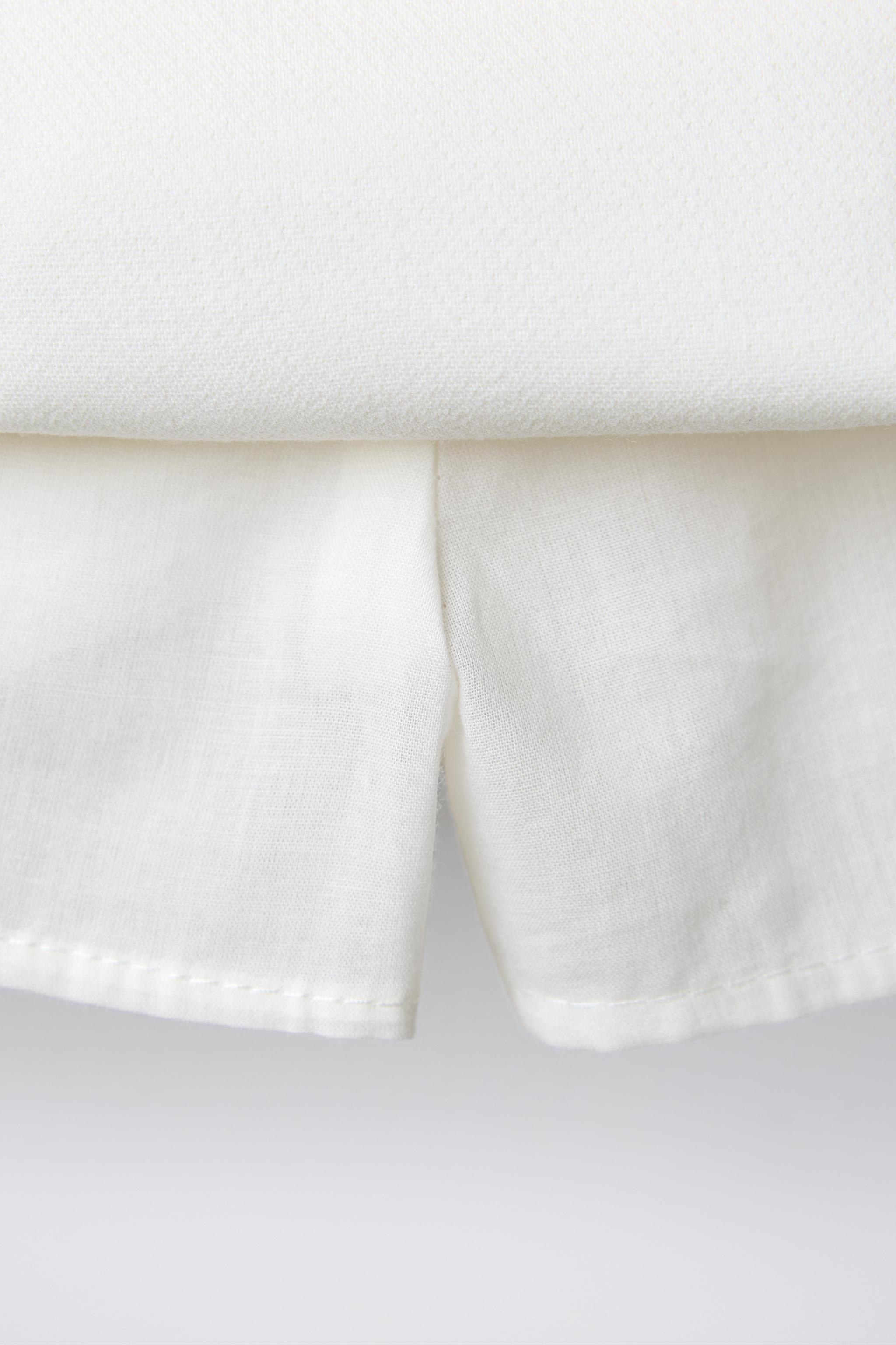 TULLE HEM BOX PLEAT SKIRT